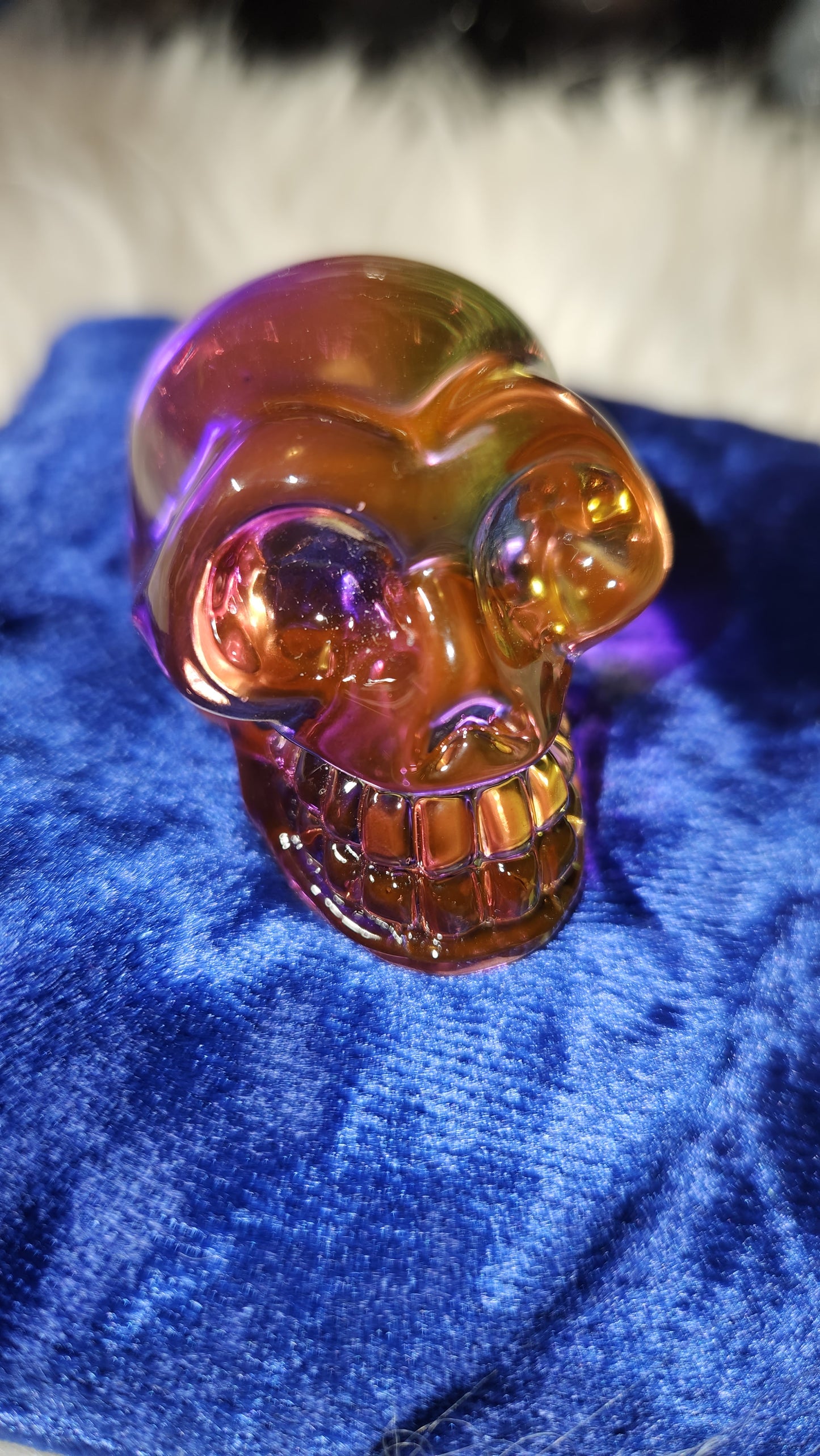 Multi colored aura glass 2" skull ( pinkish yellow)