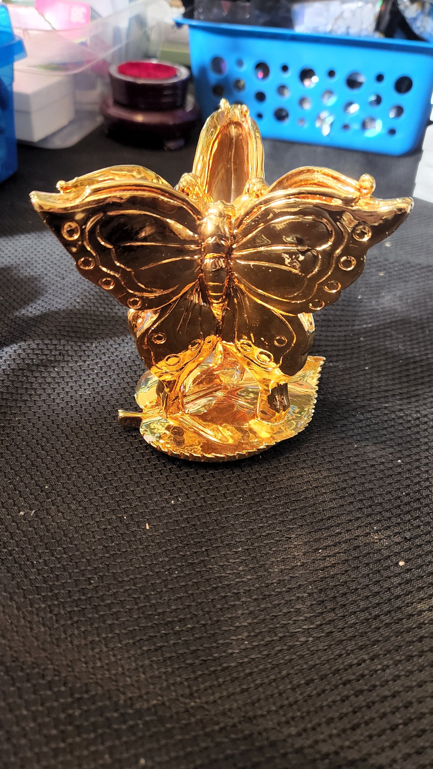 Gold butterfly sphere holder