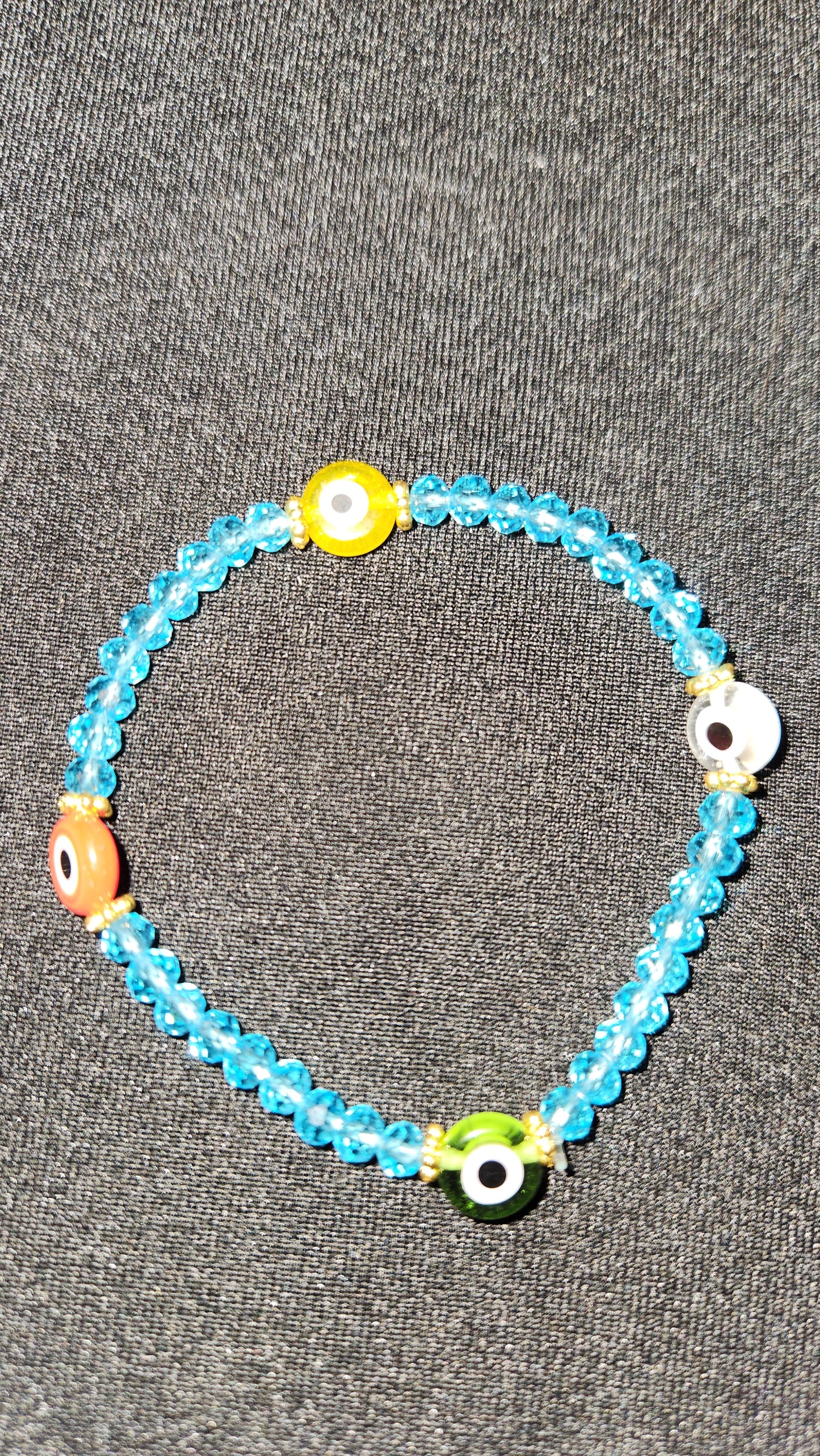 Multi colored evil eye with baby blue beads