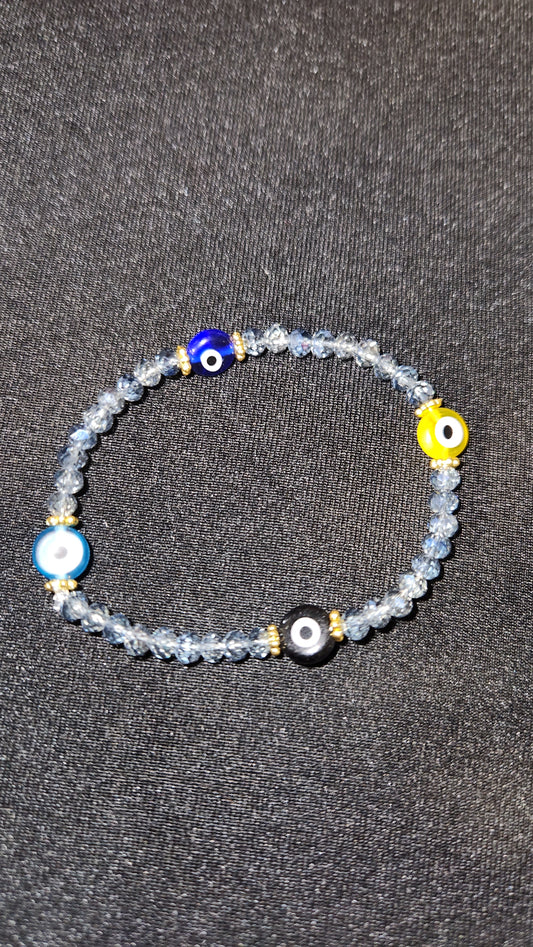 Multi colored evil eye with dark blue beads