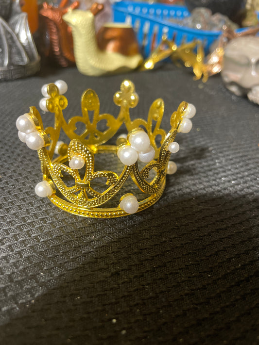 Gold crown with pearls sphere holder