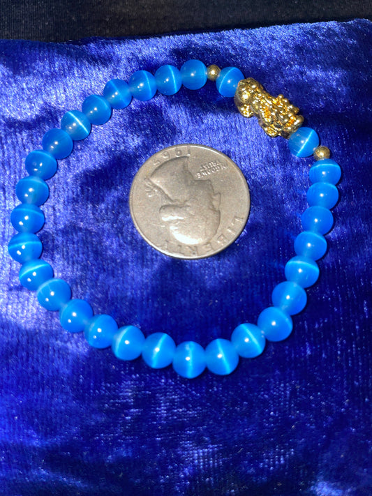 Light blue cats eye with golden pixiu charm bracelet