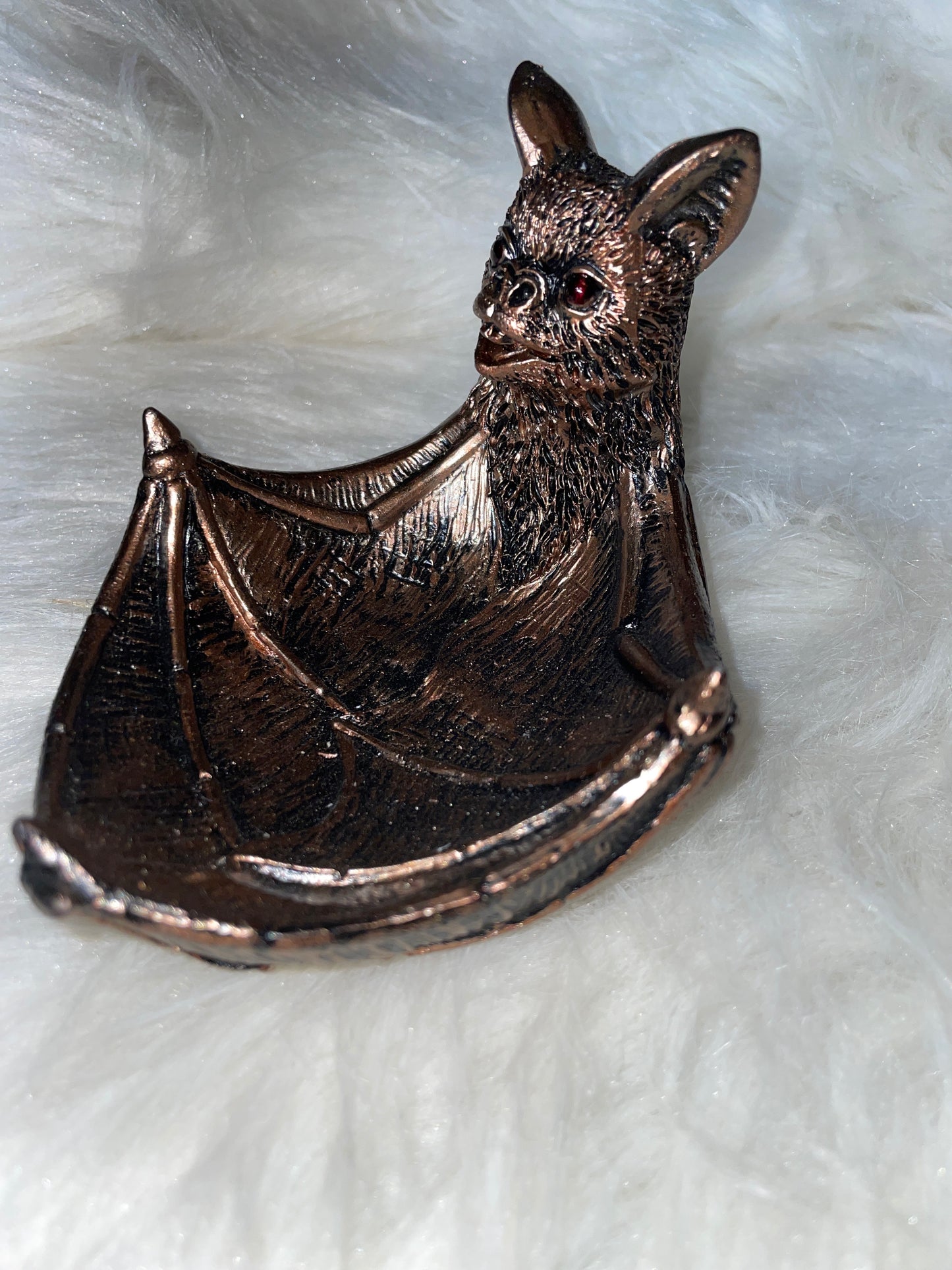 Bronze bat holder