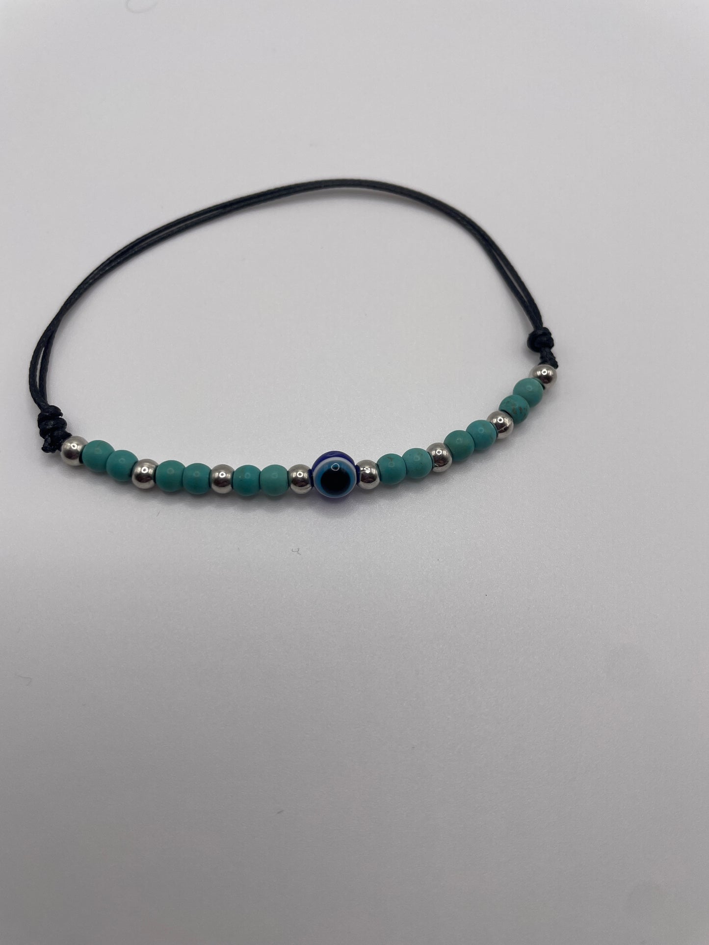 Evil eye with faux turquoise on pull cord bracelet