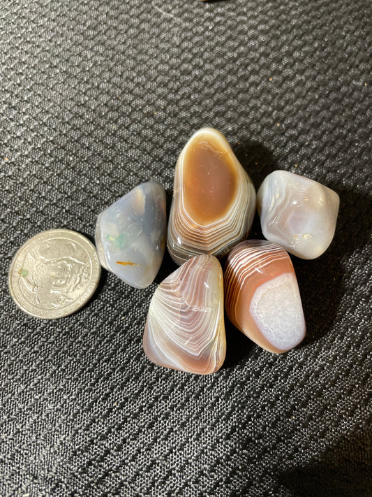 Banded agate tumbles