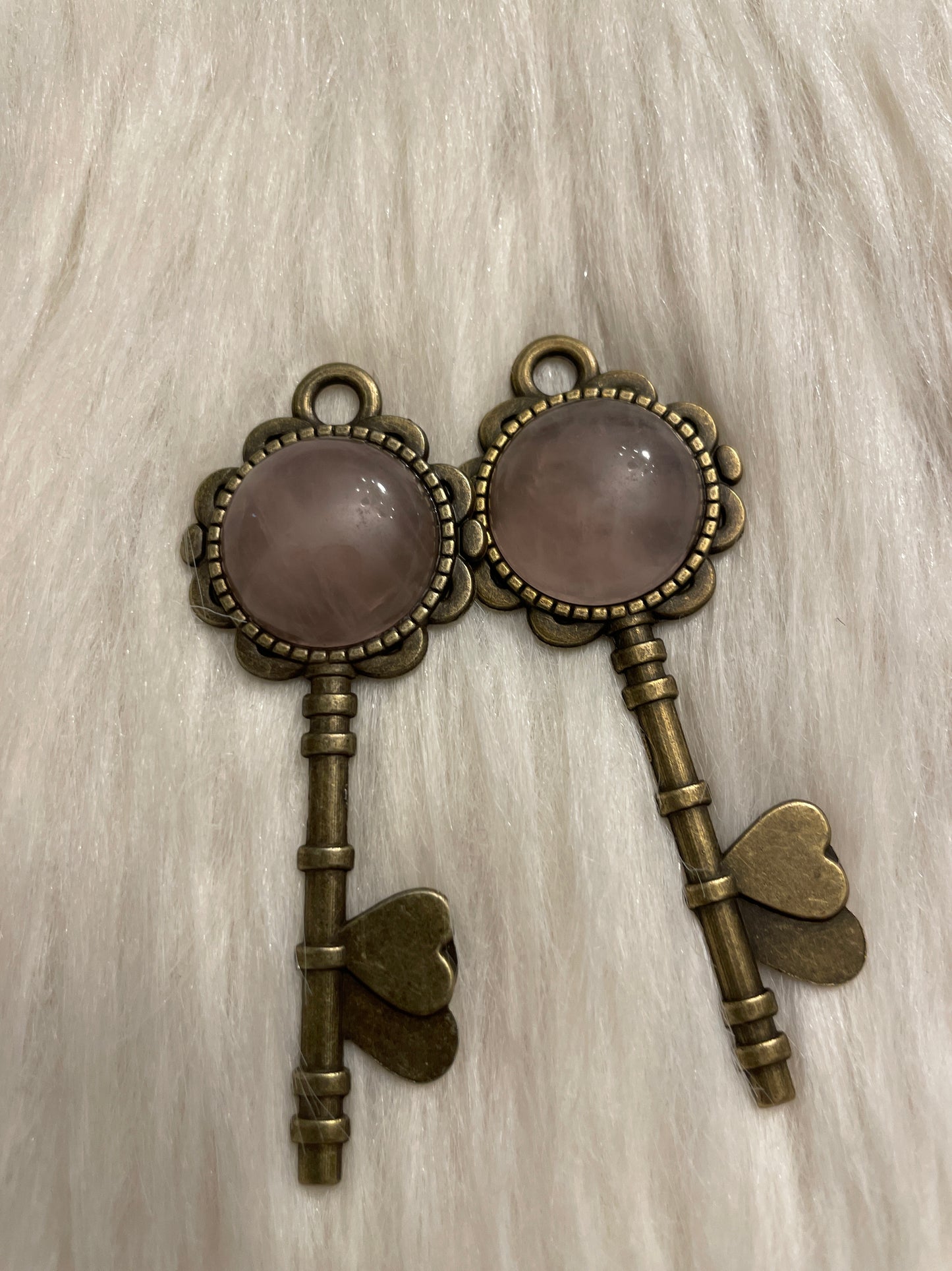 Rose quartz key pendent (copper tone)